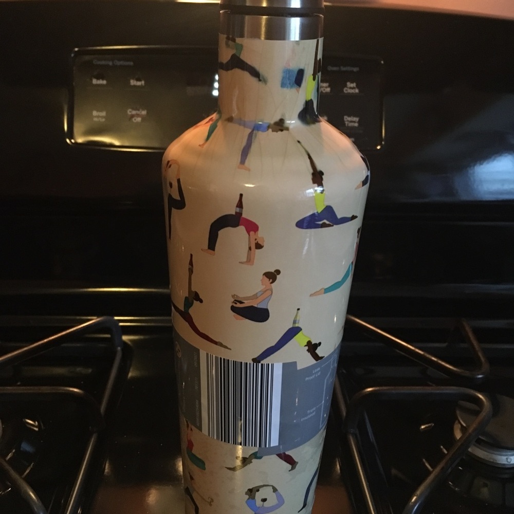 Insulated wine carafe with yoga theme